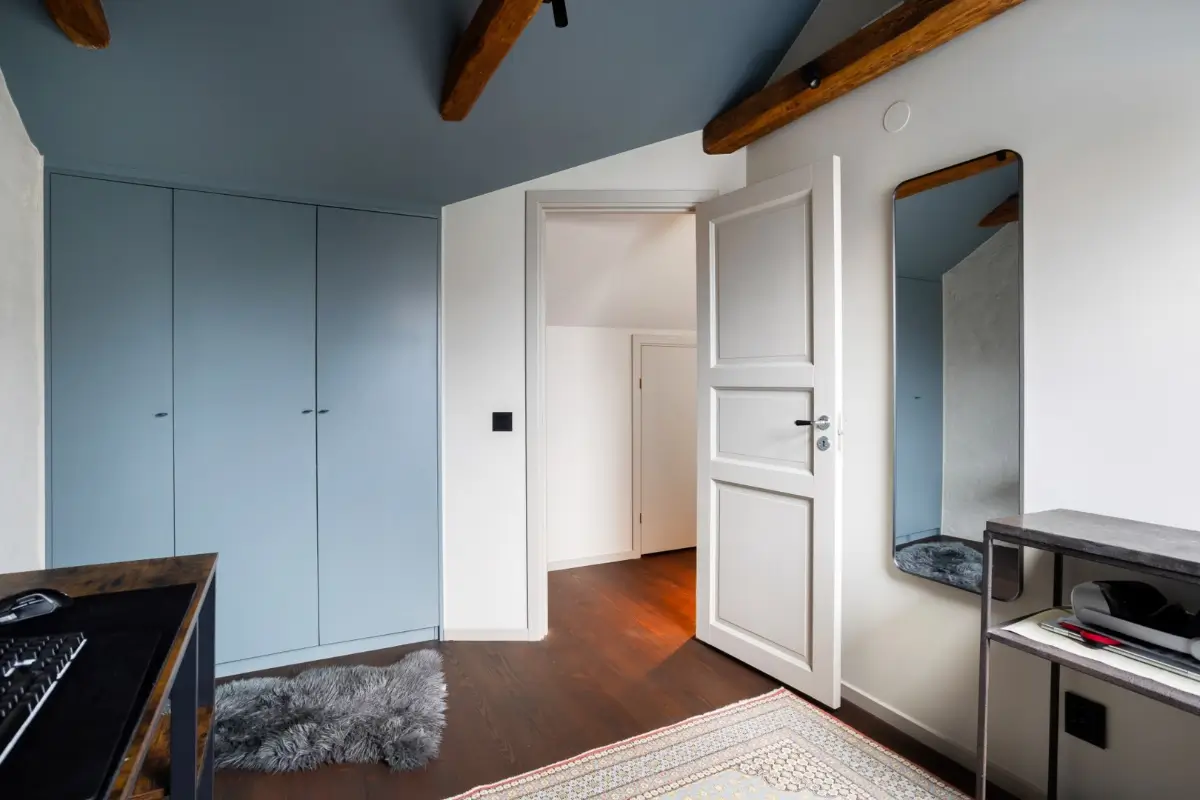 A Harmonious Color Palette in a Luxurious Stockholm Duplex Apartment 26 bedroom-blue-ceiling-built-in-wardrobes-nordroom