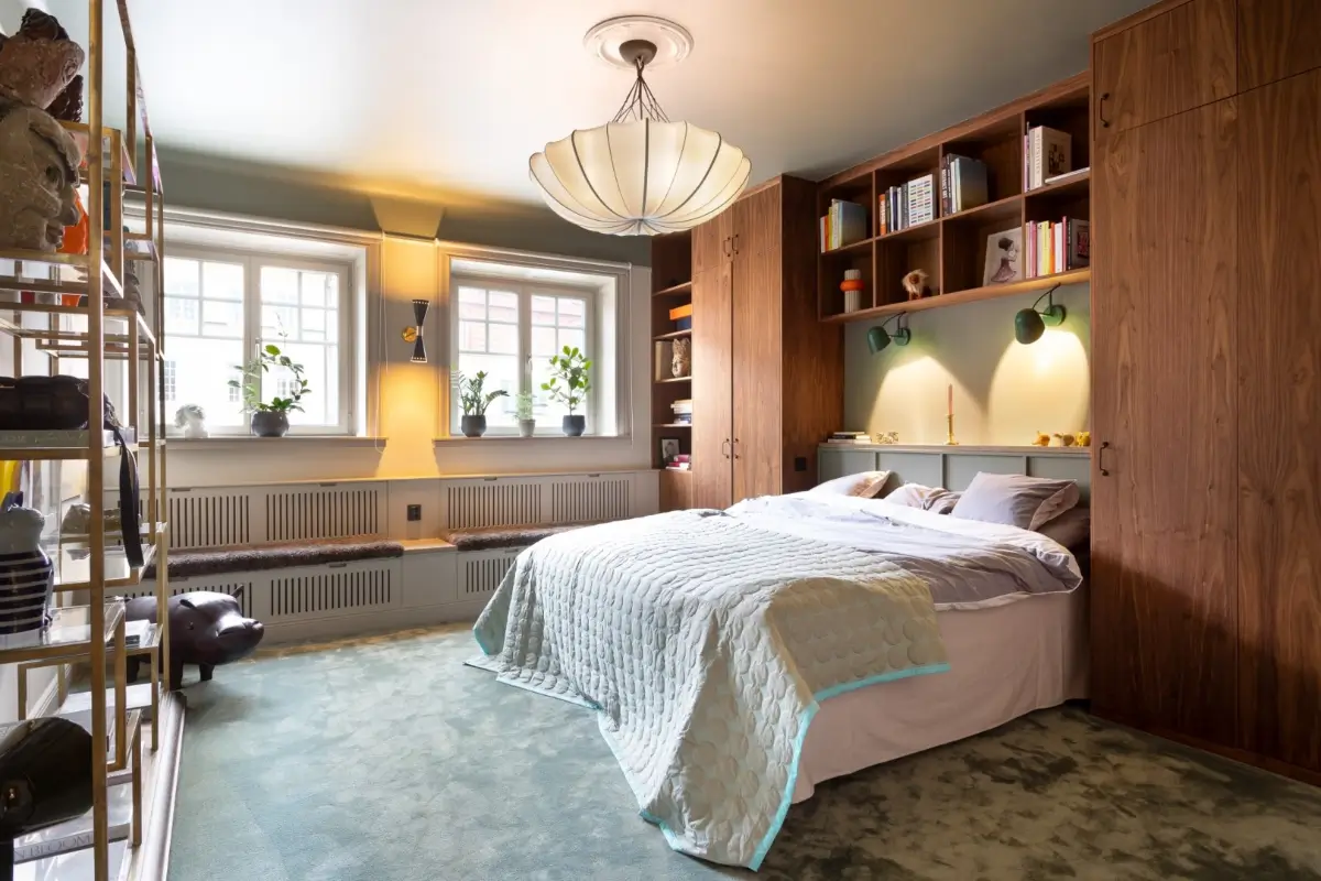 A Harmonious Color Palette in a Luxurious Stockholm Duplex Apartment 15 bedroom built-in wardrobes window seats light blue carpet