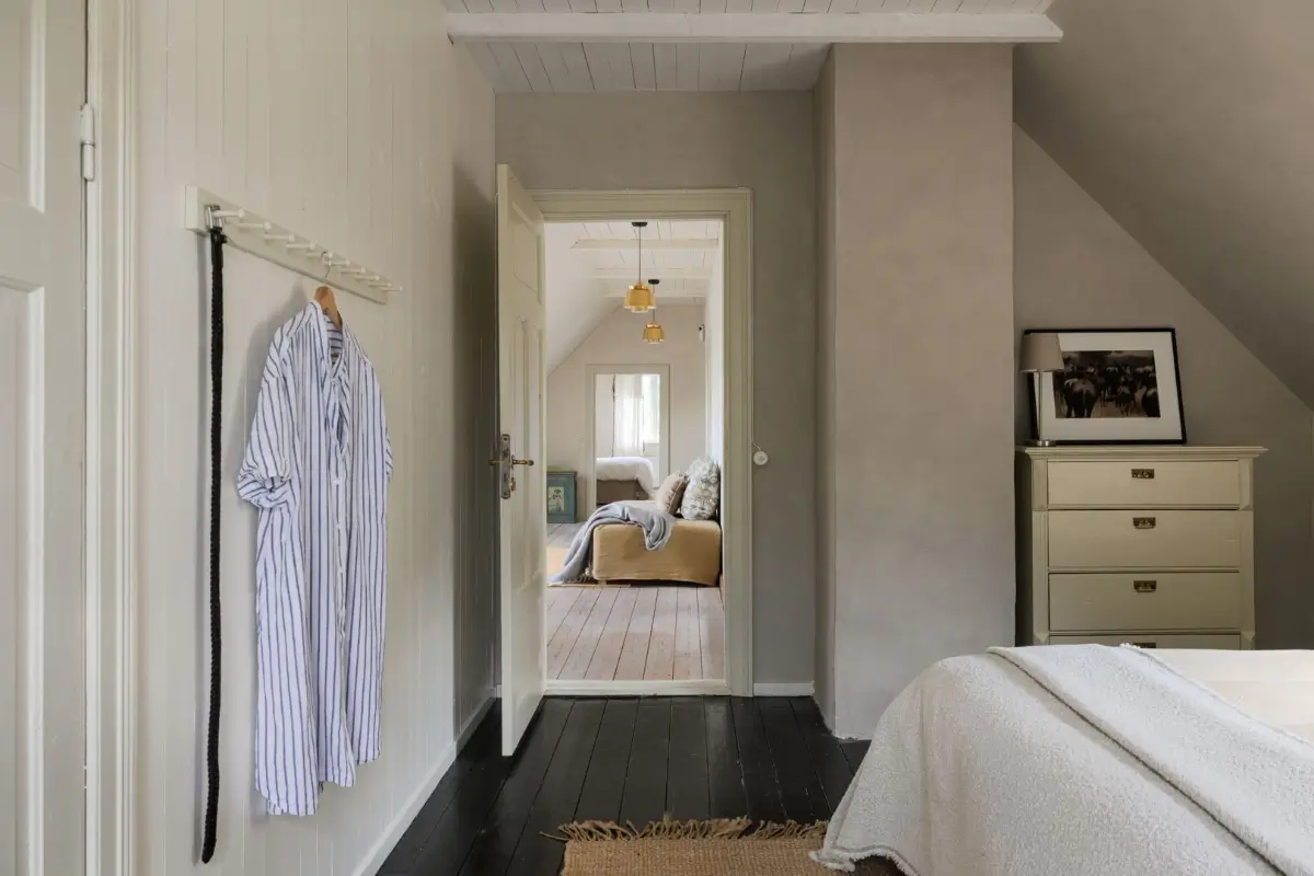 Historic Character and a deVOL Kitchen in a Swedish Country House 32 bedroom view into sitting room