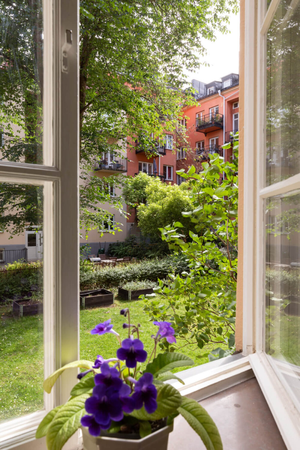 A 1930s Stockholm Apartment With Views of a Lush Garden 12 bedroom window courtyard