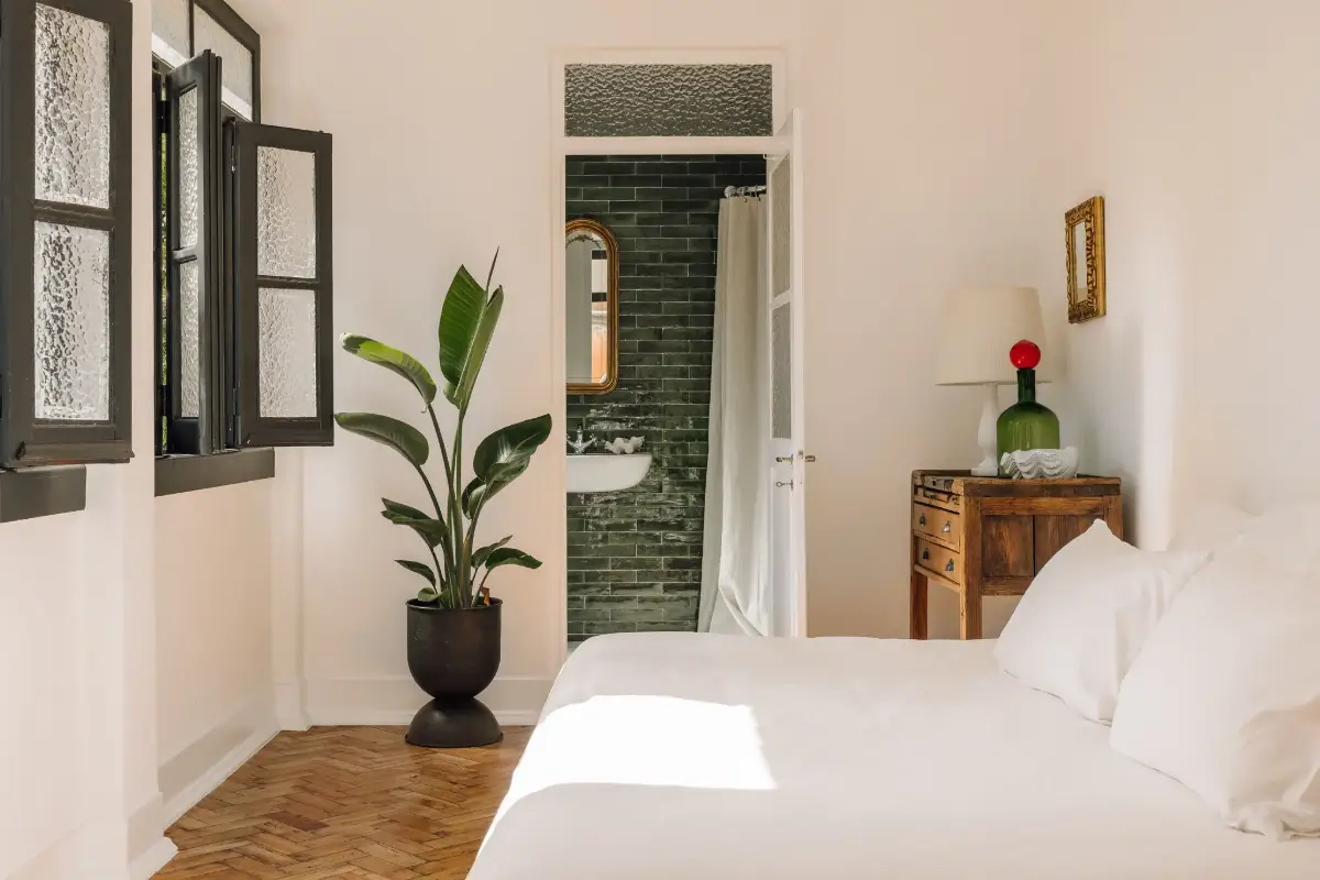 An Art Deco Villa with a Moroccan-Inspired Garden in Portugal 15 bedroom with green en-suite bathroom