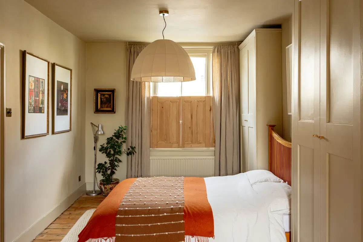 A Muted Color Palette and Original Details in a Victorian Terrace House 13 bedroom wooden window shutters