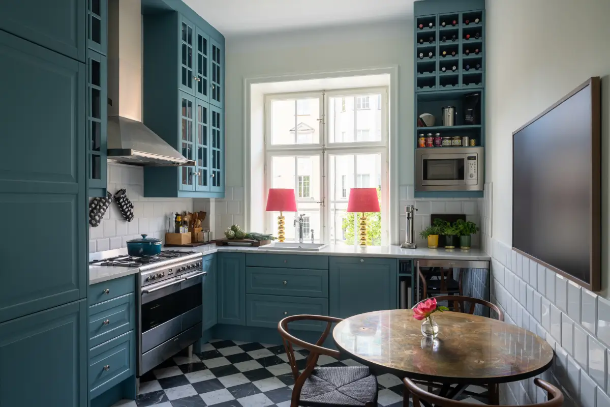 A Classic Stockholm Apartment with a Sky-Blue Kitchen 5 blue kitchen checkerboard marble floor nordroom