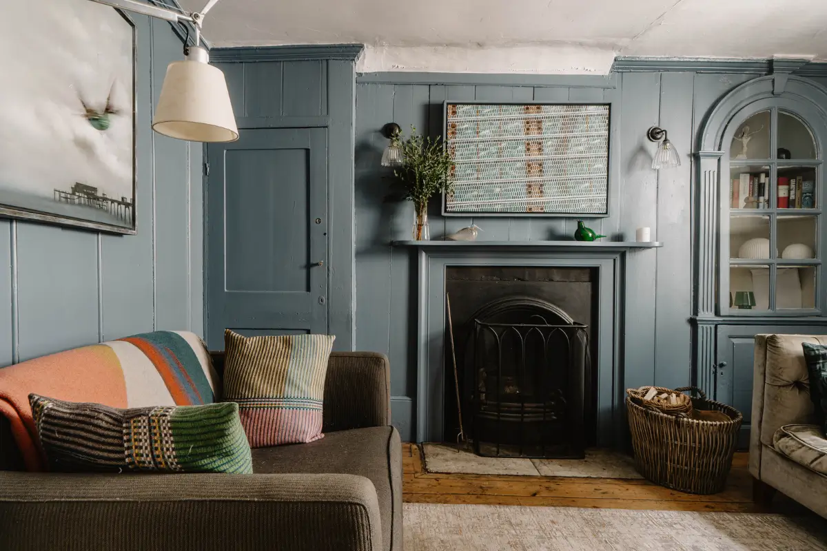 A 17th-Century Home with Original Elements in an English Seaside Town 6 blue living room built-in cabinets fireplace