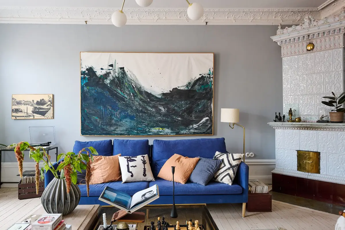 A Classic Stockholm Family Apartment with a Separate Studio 5 blue sofa living room original elements