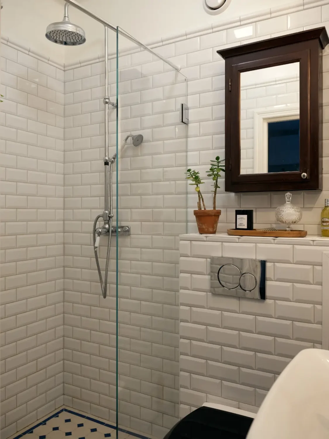 A Muted Color Palette in a Cozy 1920s Apartment in Stockholm 21 classic white-tiled bathroom