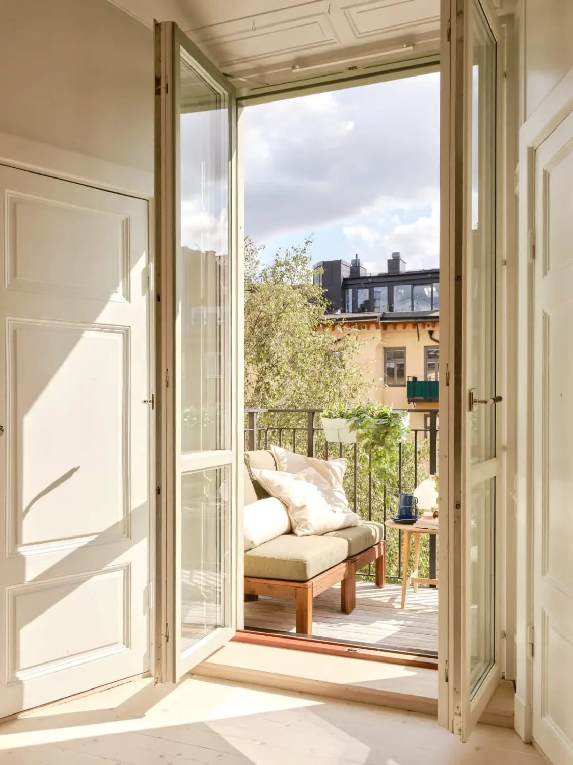 Pastel Hues in a Light-Filled 1880s Apartment in Stockholm 15 courtyard balcony