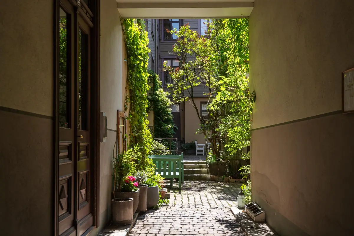 A Dark Gray Swedish Apartment with an Olive Green Kitchen 28 courtyard A Dark Gray Swedish Apartment with an Olive Green Kitchen