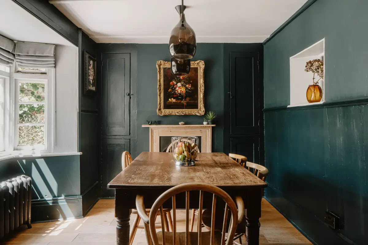 A 17th-Century Home with Original Elements in an English Seaside Town 1 dark blue dining room with bay window