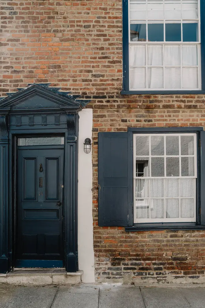 A 17th-Century Home with Original Elements in an English Seaside Town 24 dark blue front door shutters historic english house