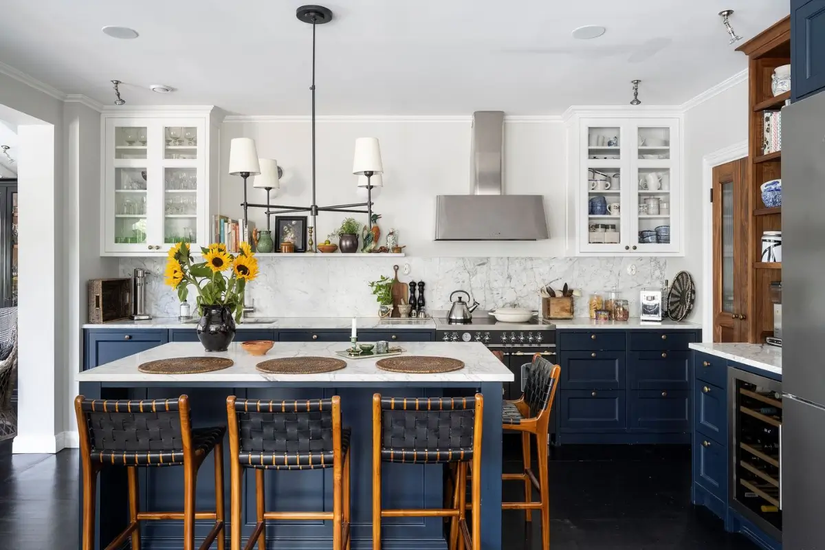 Scandinavian Design Meets The Hamptons in a Swedish Country House 13 dark blue kitchen with island seating nordroom