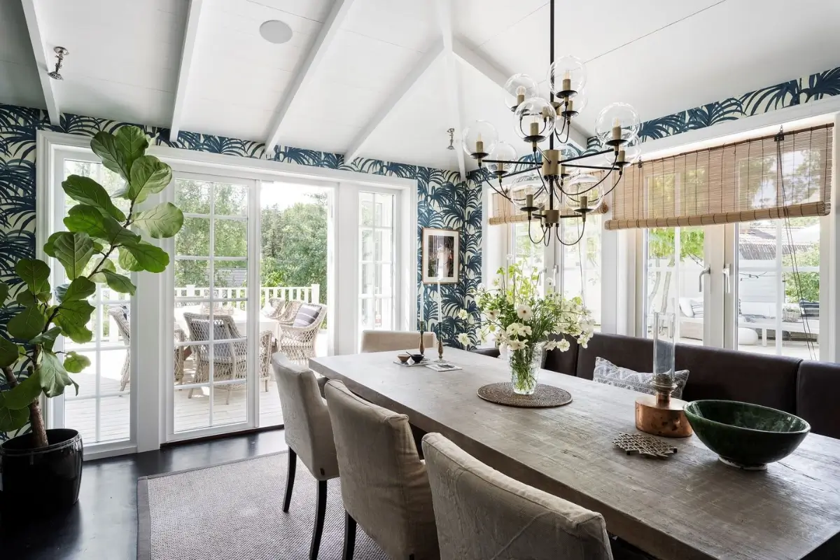 Scandinavian Design Meets The Hamptons in a Swedish Country House 27 dining room blue leaf wallpaper nordroom