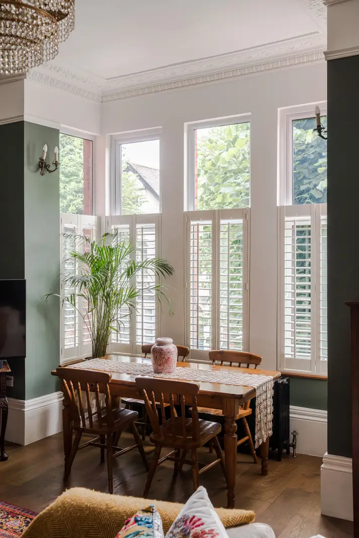 A Three-Bedroom Duplex Apartment with a Large Roof Terrace in London 4 dining table bay window