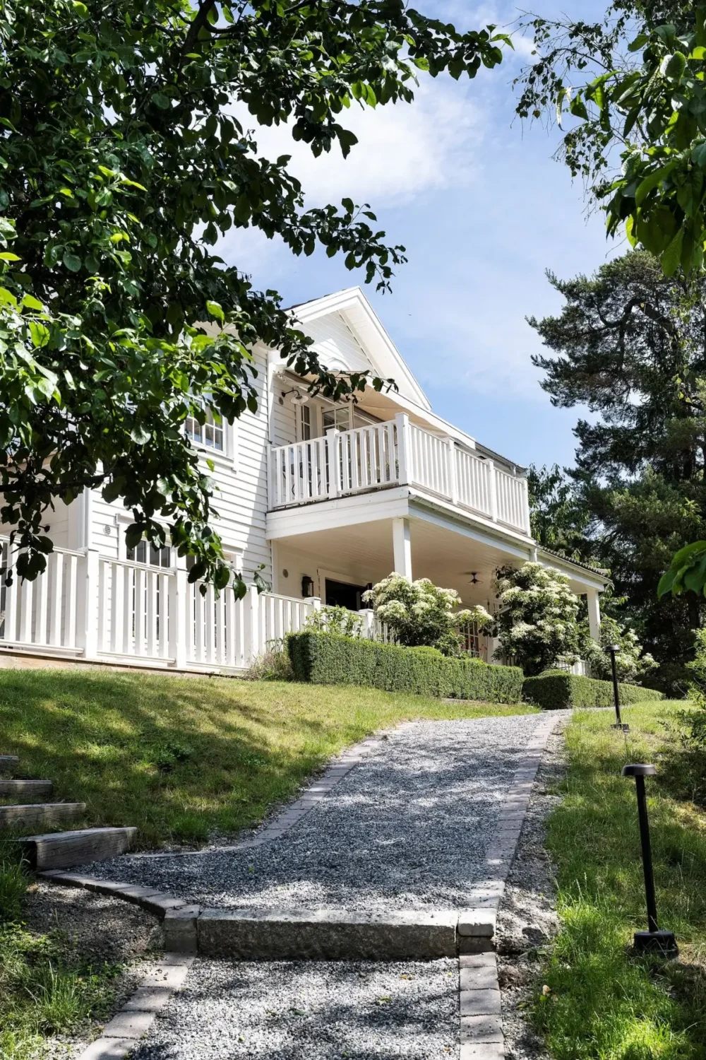 Scandinavian Design Meets The Hamptons in a Swedish Country House 65 entry path white swedish country house