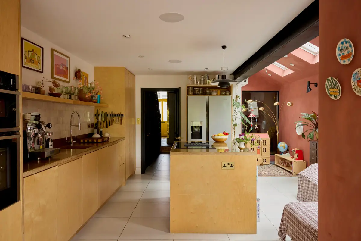 A Victorian Home with a Rich Color Palette and a Lush Garden 9 extended kitchen with island and terracotta walls