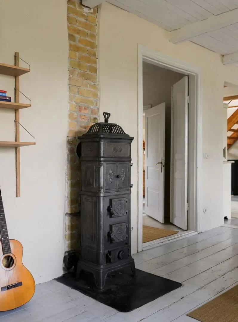 Historic Character and a deVOL Kitchen in a Swedish Country House 19 fireplace brick wall