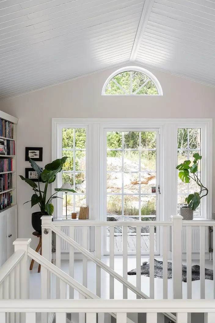 Scandinavian Design Meets The Hamptons in a Swedish Country House 36 first floor sitting room with balcony