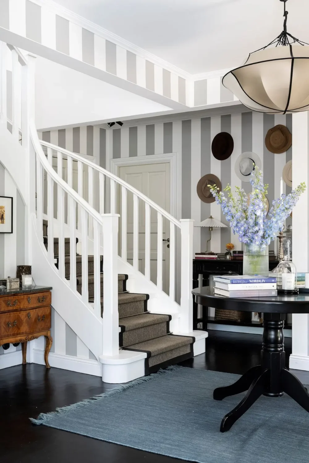 Scandinavian Design Meets The Hamptons in a Swedish Country House 8 foyer-staircase-gray-striped-walls-nordroom