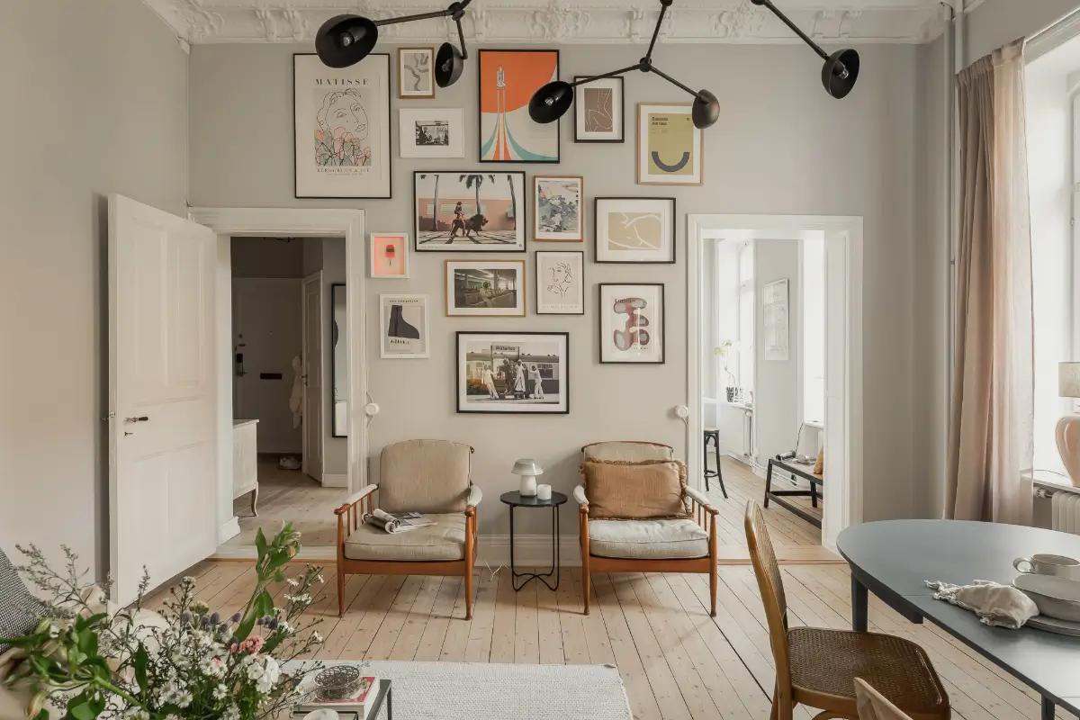 A Gray Scandinavian Apartment with a Royal History 2 gallery wall gray wall living room