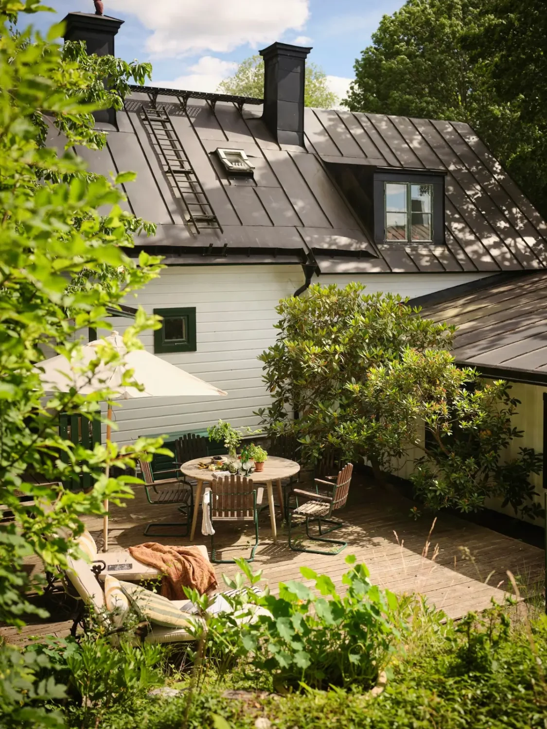 A Colorful Family Home in an Old Gardener's Cottage in Sweden 44 garden terrace