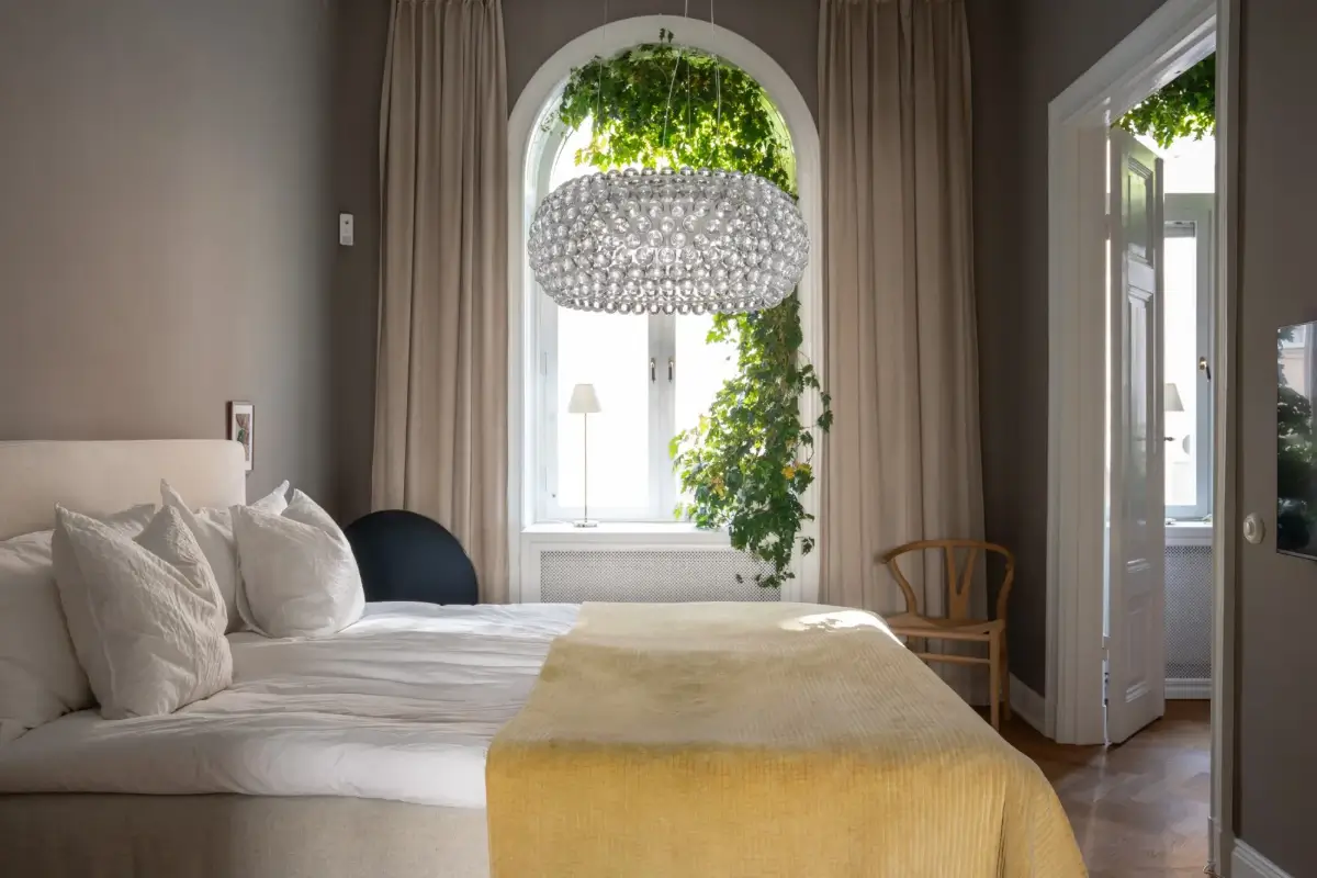 Arched Windows and Design Classics in a 19th Century Apartment 12 gray bedroom arched window