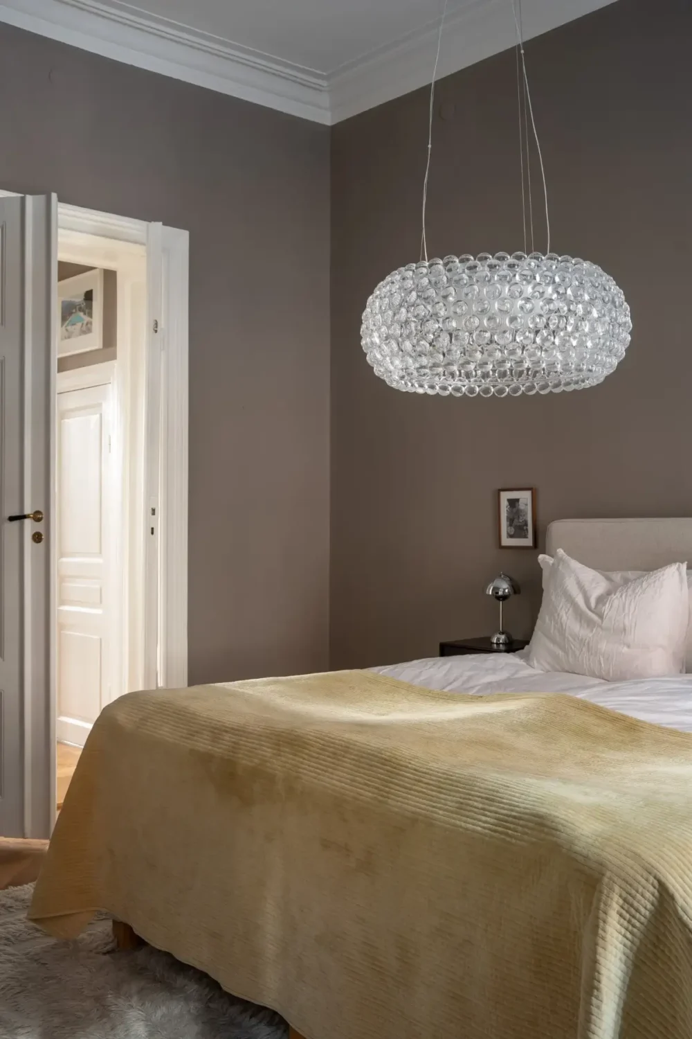 Arched Windows and Design Classics in a 19th Century Apartment 13 gray bedroom butter yellow throw
