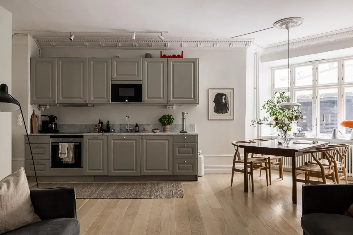 Classic Period Elements in a Comfortable Two-Bedroom Apartment 3 gray kitchen large dining table