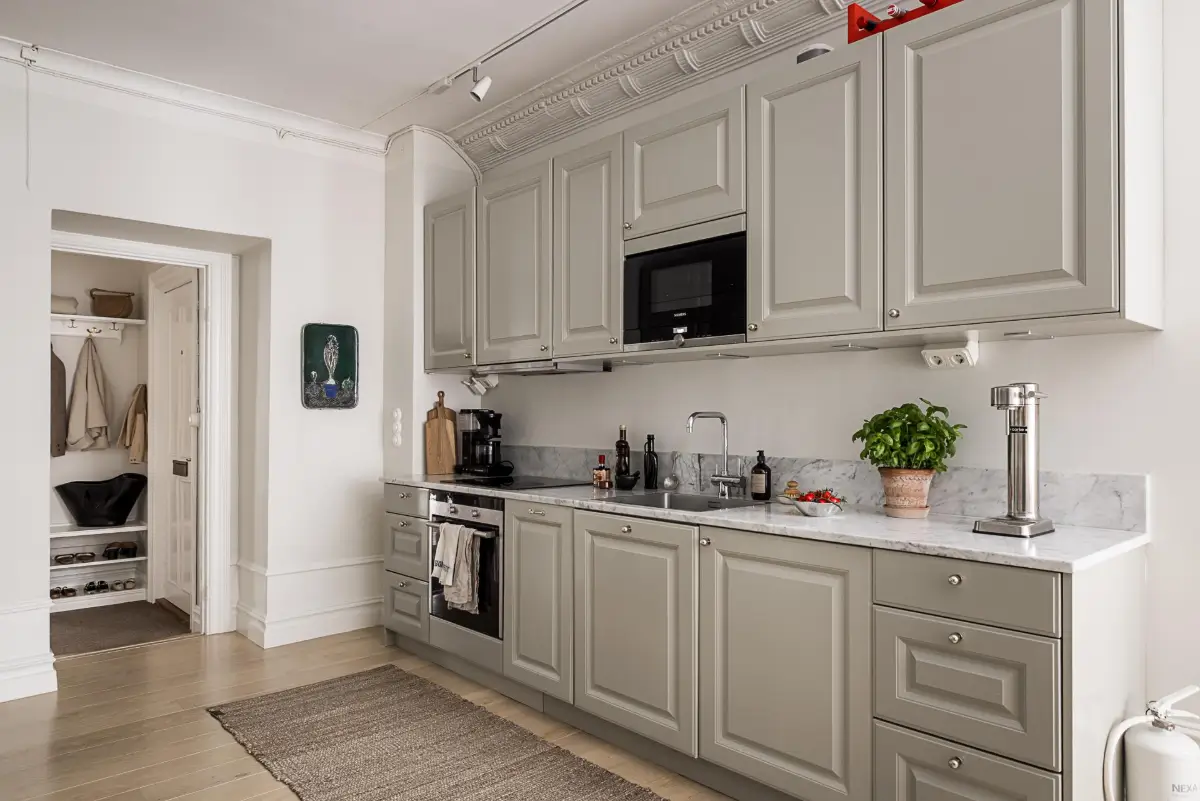 Classic Period Elements in a Comfortable Two-Bedroom Apartment 5 gray kitchen marble countertop
