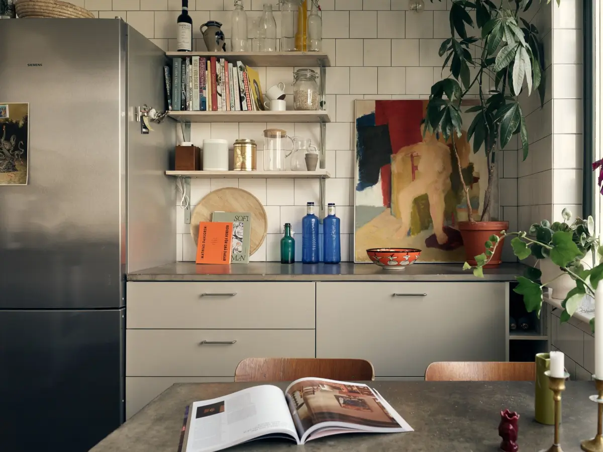 Industrial Elements in a 1960s Duplex Apartment in Stockholm 32 gray kitchen with shelves