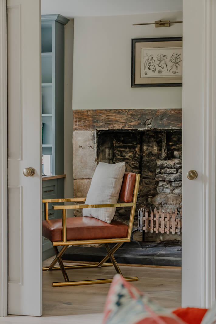 A Stone English Cottage with a Blue and Pink Kitchen 6 gray sliding doors