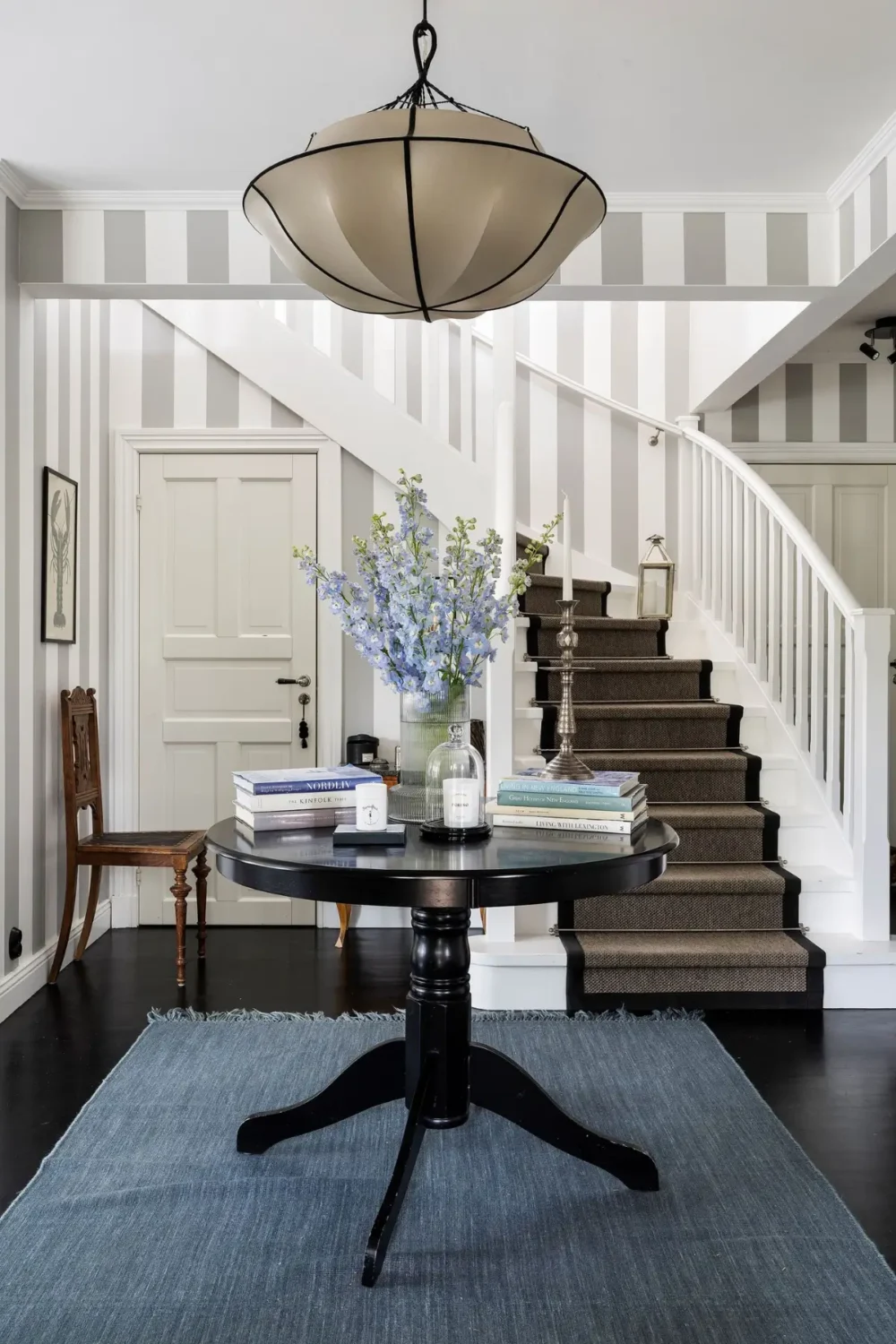 Scandinavian Design Meets The Hamptons in a Swedish Country House 7 gray striped foyer