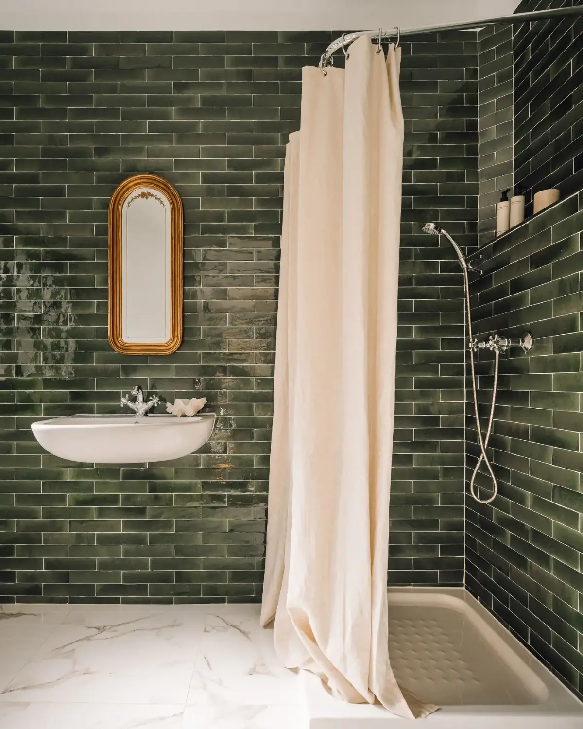 An Art Deco Villa with a Moroccan-Inspired Garden in Portugal 16 green bathroom with marble floor tiles