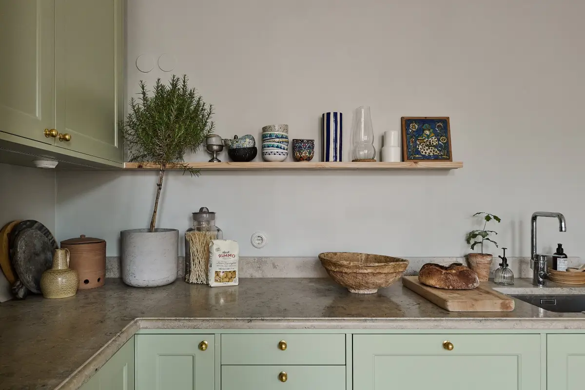 A Classic Stockholm Family Apartment with a Separate Studio 12 green kitchen brass knobs