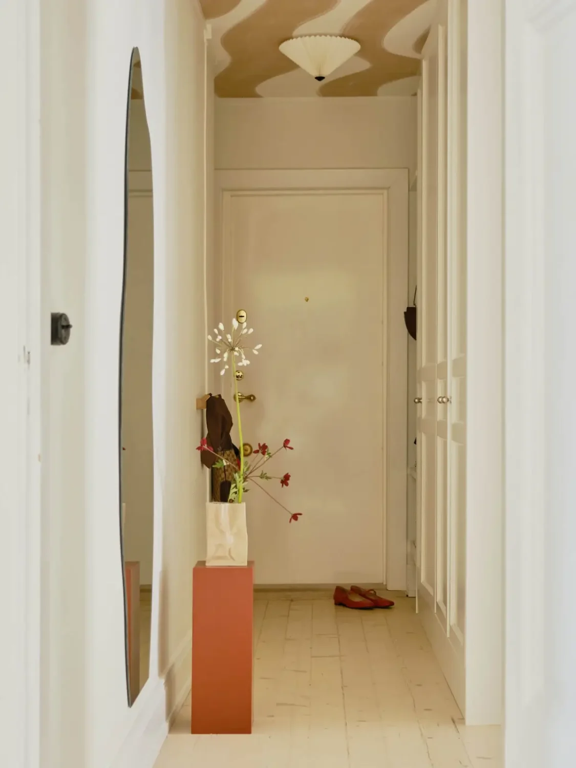 Pastel Hues in a Light-Filled 1880s Apartment in Stockholm 24 hall painted wavy ceiling built-in wardrobes nordroom