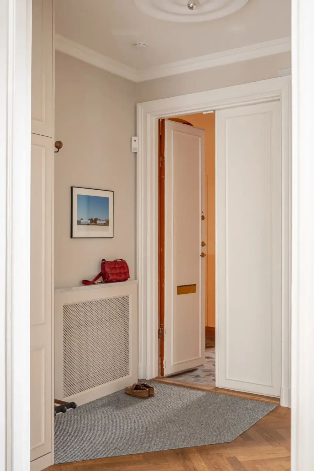 Arched Windows and Design Classics in a 19th Century Apartment 23 hall parquet floor Arched Windows and Design Classics in a 19th Century Apartment
