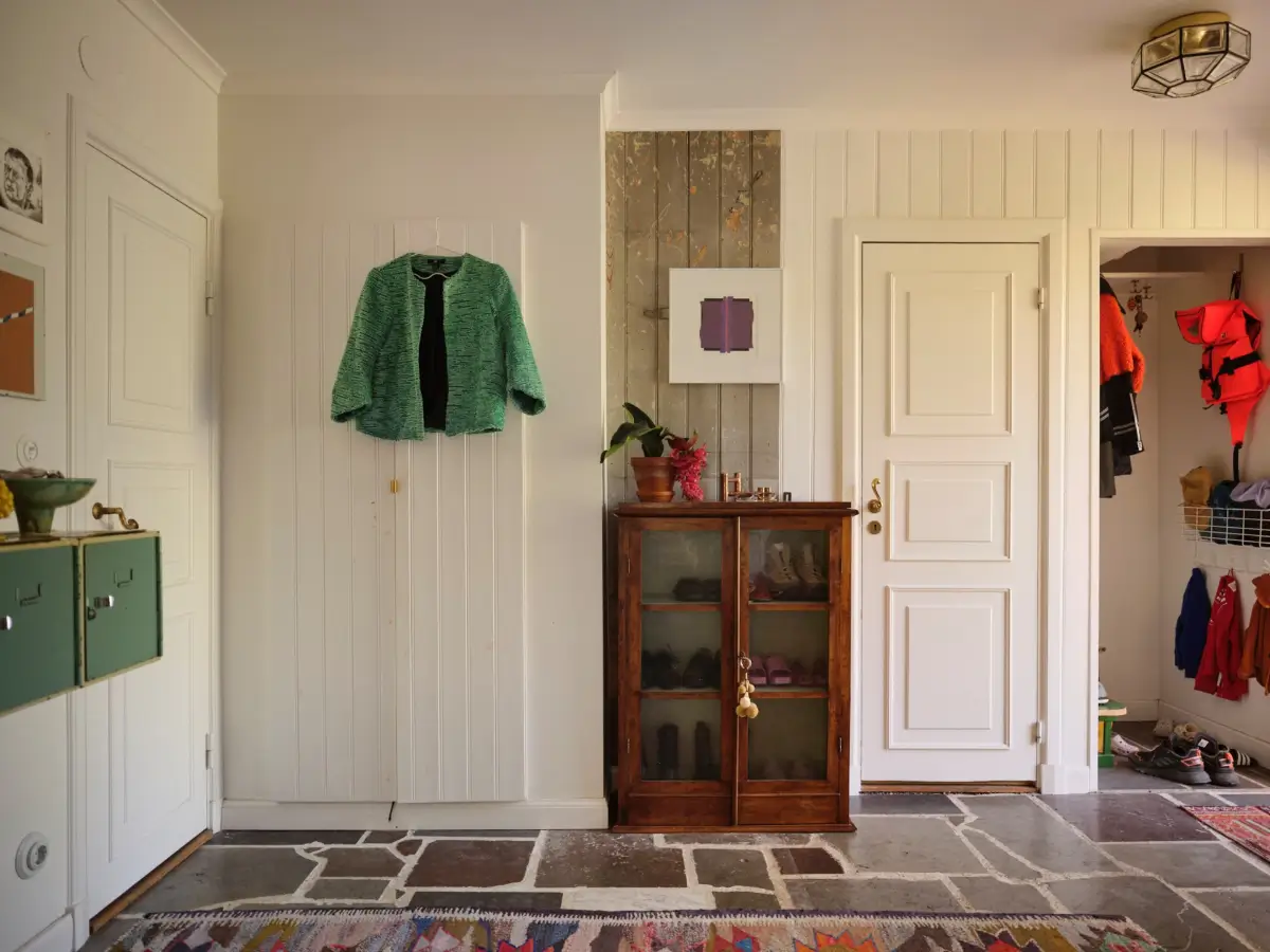 A Colorful Family Home in an Old Gardener's Cottage in Sweden 18 hall stone floor