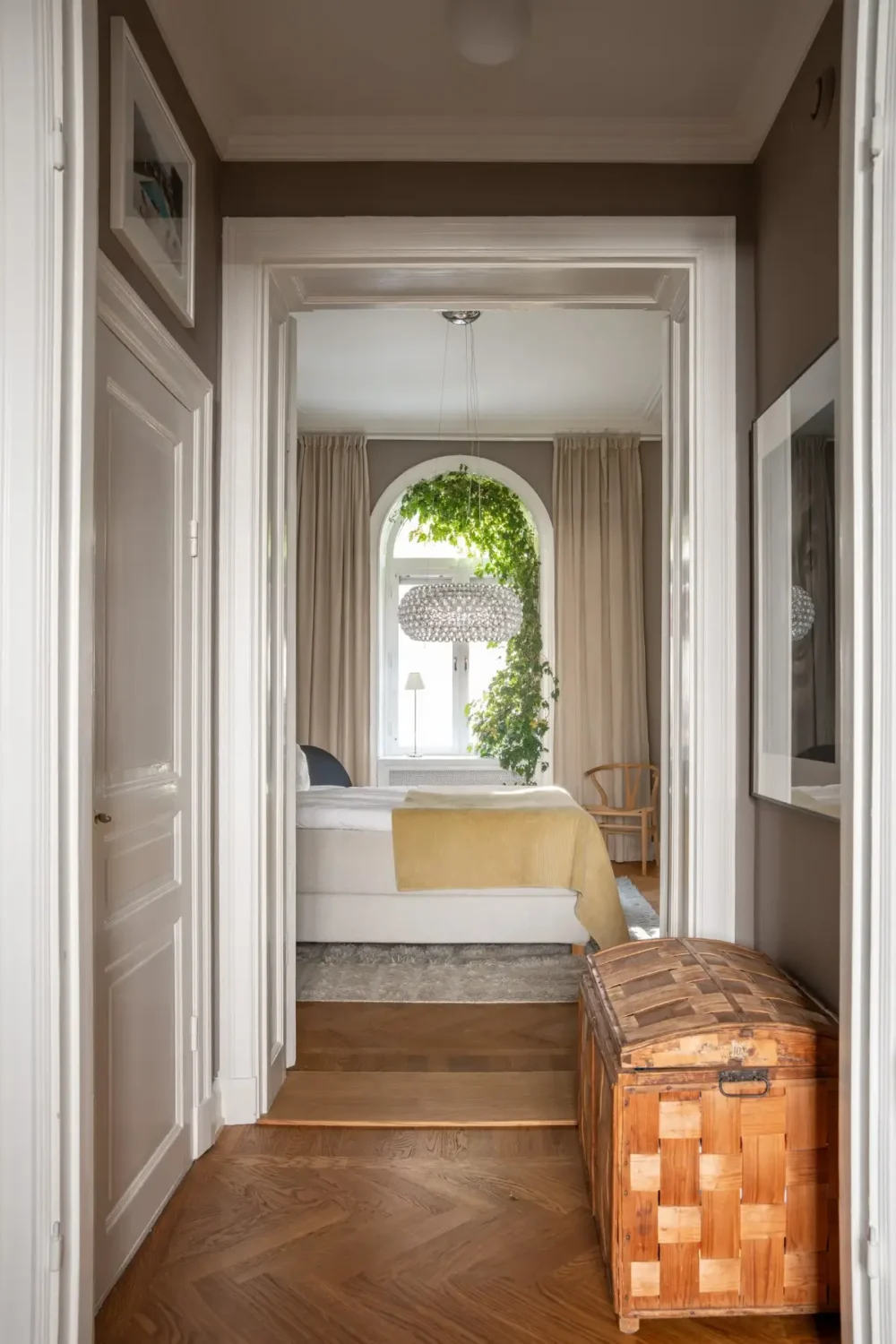 Arched Windows and Design Classics in a 19th Century Apartment 16 hall view into bedroom