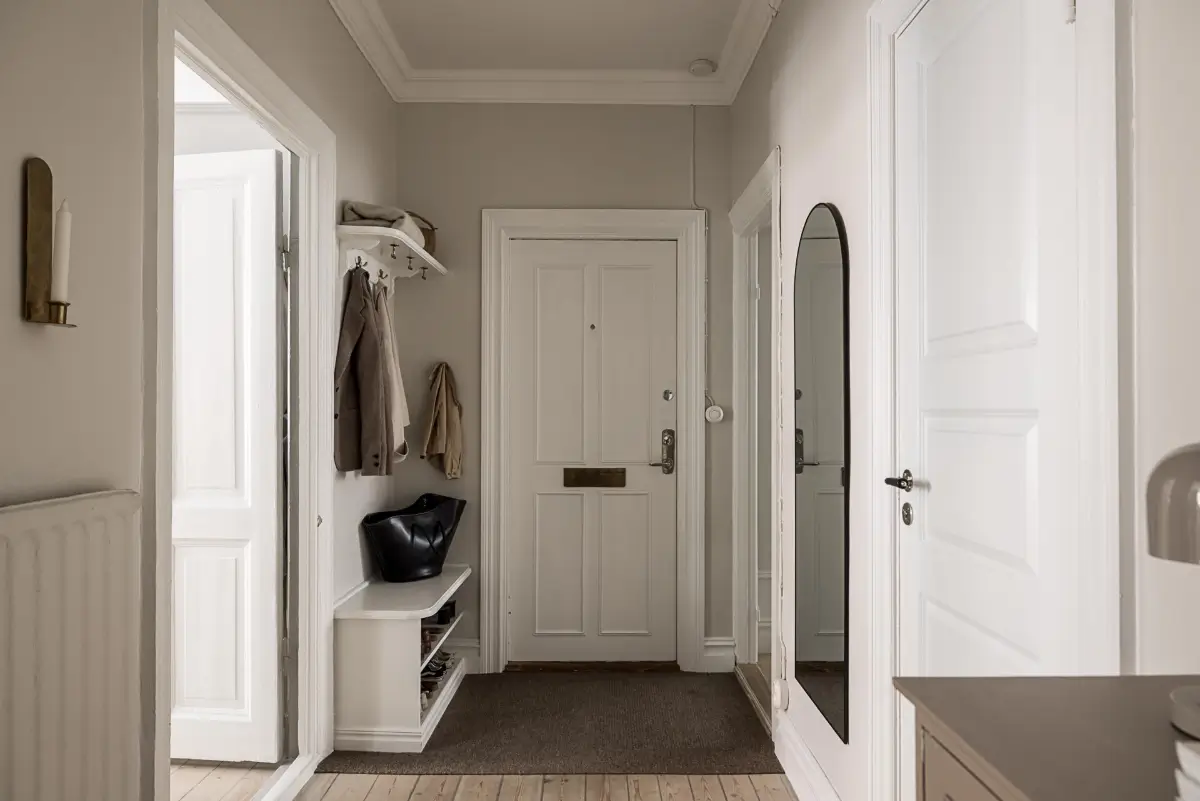 Classic Period Elements in a Comfortable Two-Bedroom Apartment 27 hall with hat shelf bench with shoe storage Classic Period Elements in a Comfortable Two-Bedroom Apartment