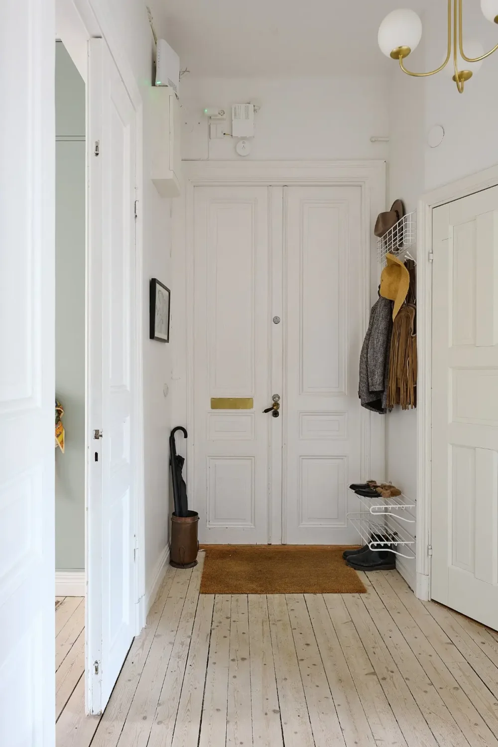 A Classic Stockholm Family Apartment with a Separate Studio 32 hall wooden floor white walls