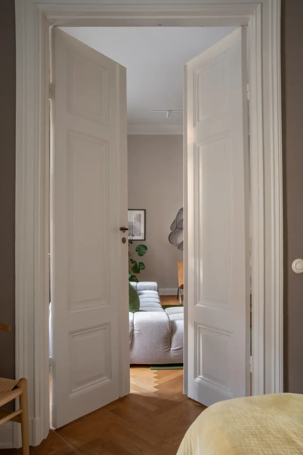 Arched Windows and Design Classics in a 19th Century Apartment 14 high double wooden doors