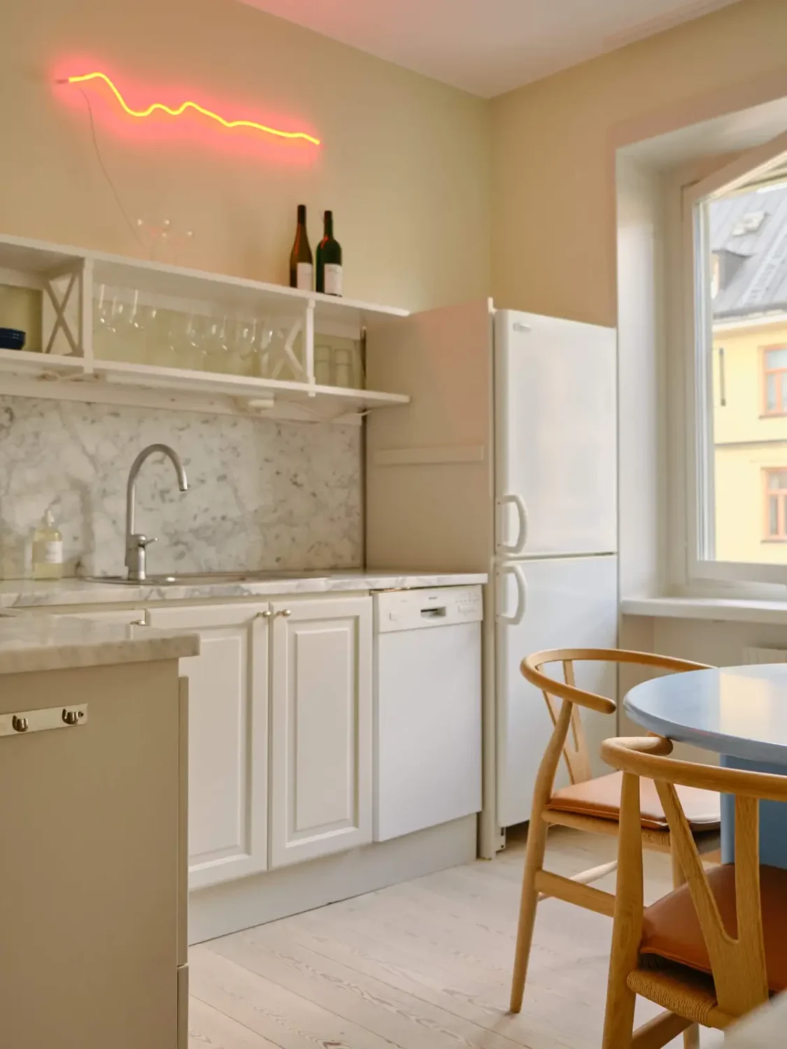 Pastel Hues in a Light-Filled 1880s Apartment in Stockholm 19 kitchen marble countertop backsplash