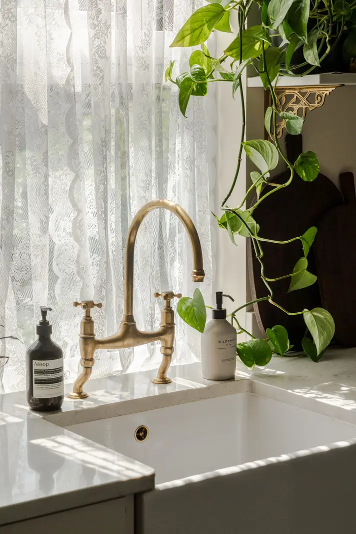 A Three-Bedroom Duplex Apartment with a Large Roof Terrace in London 10 kitchen sink lace curtains