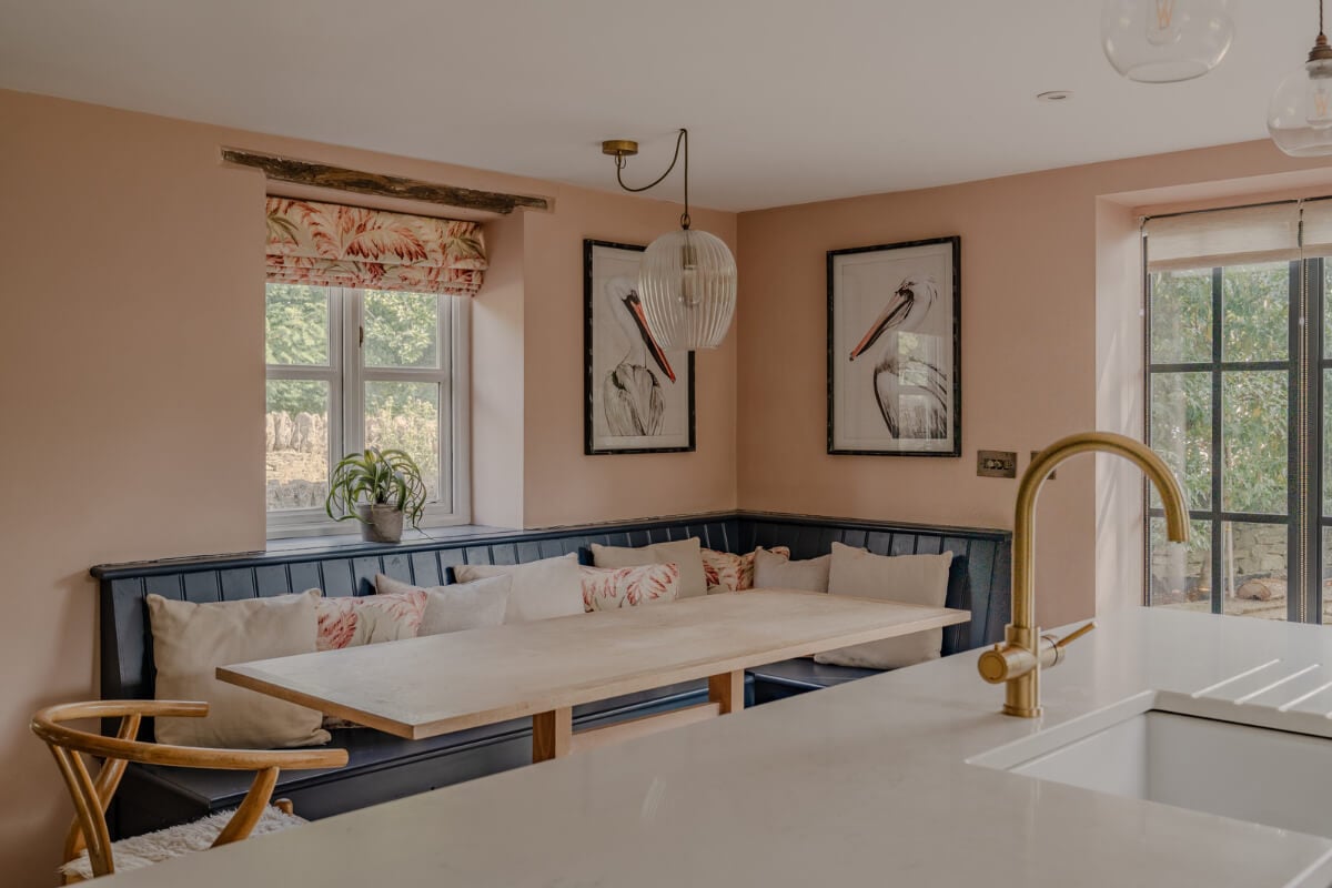 A Stone English Cottage with a Blue and Pink Kitchen 3 kitchen table with built-in banquette