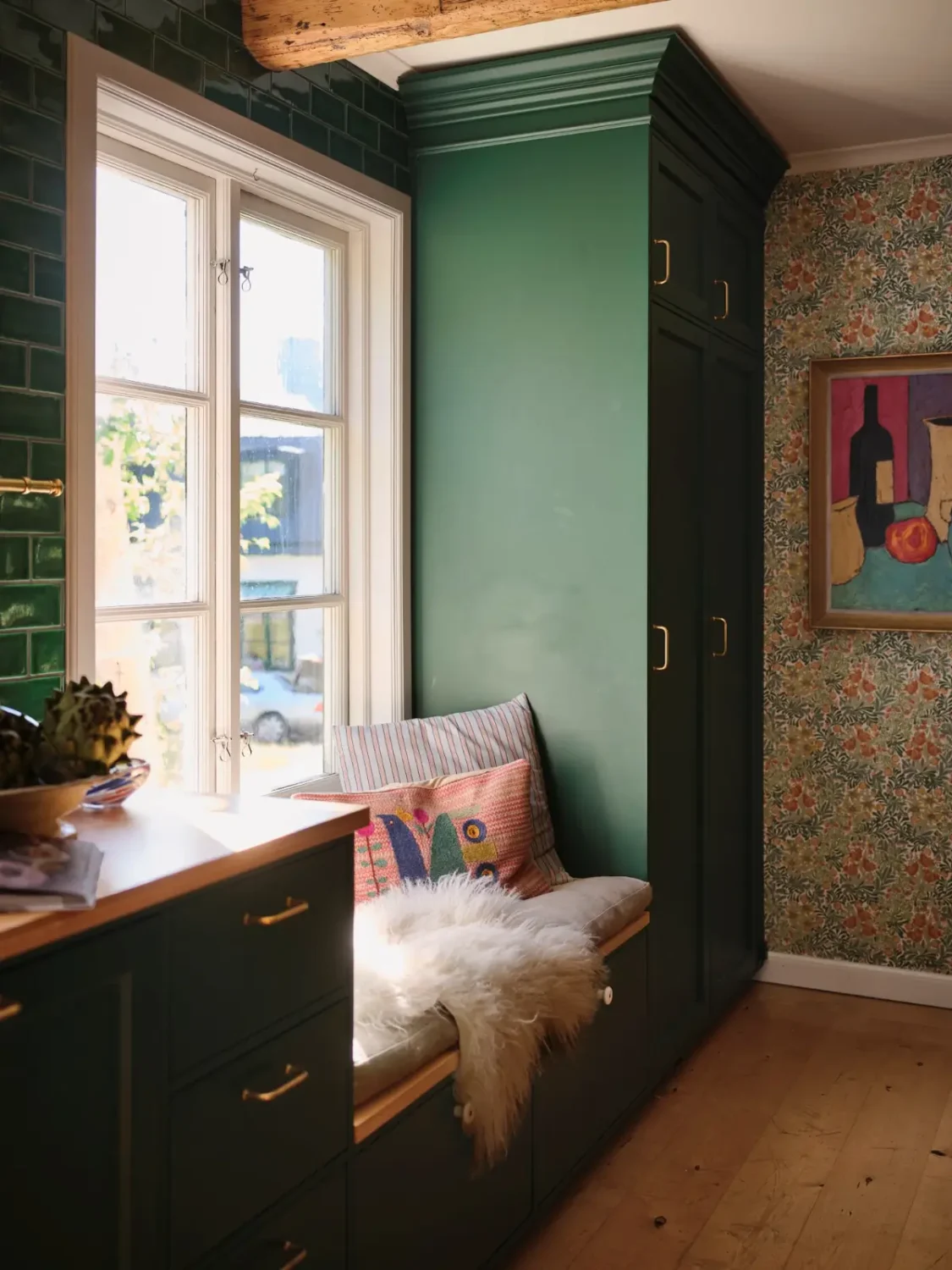 A Colorful Family Home in an Old Gardener's Cottage in Sweden 3 kitchen window seat