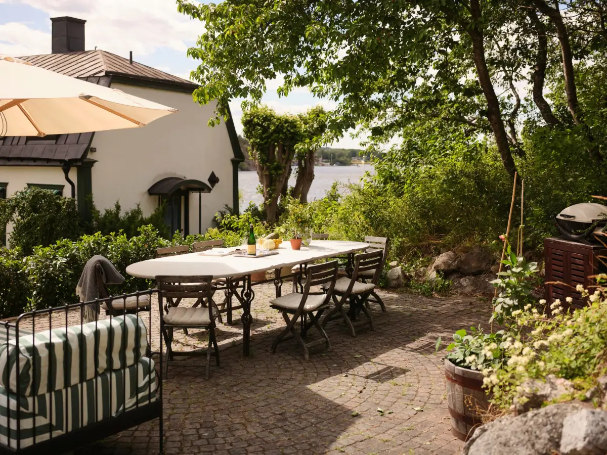 A Colorful Family Home in an Old Gardener's Cottage in Sweden 39 large outdoor dining table
