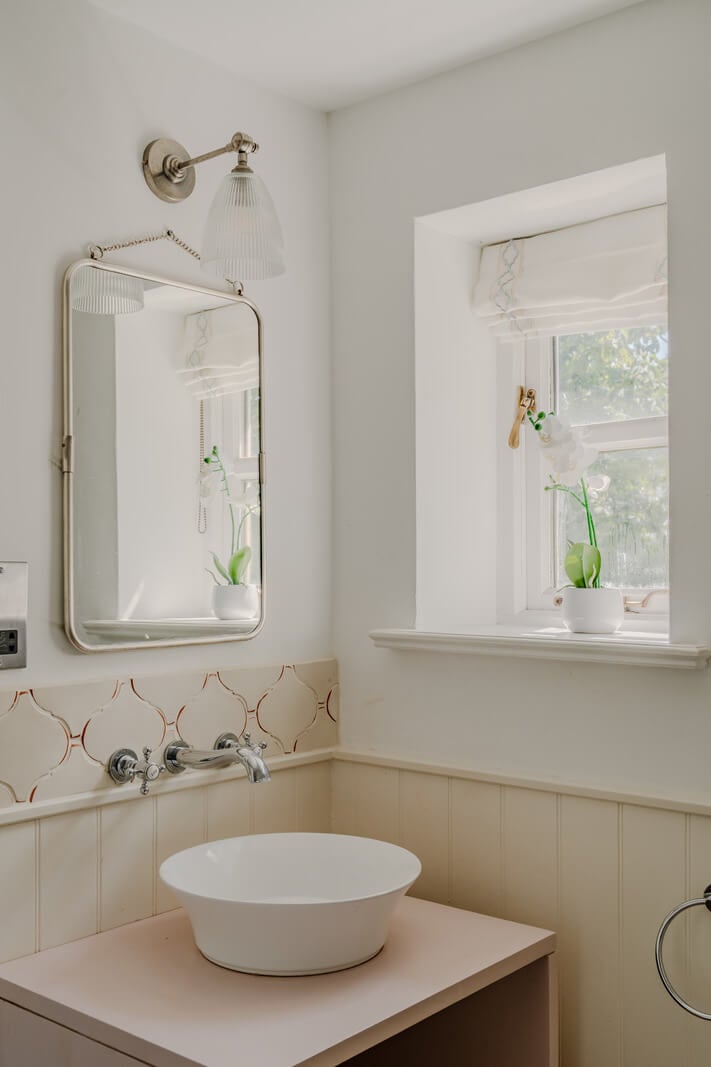 A Stone English Cottage with a Blue and Pink Kitchen 17 light cottage bathroom paneling