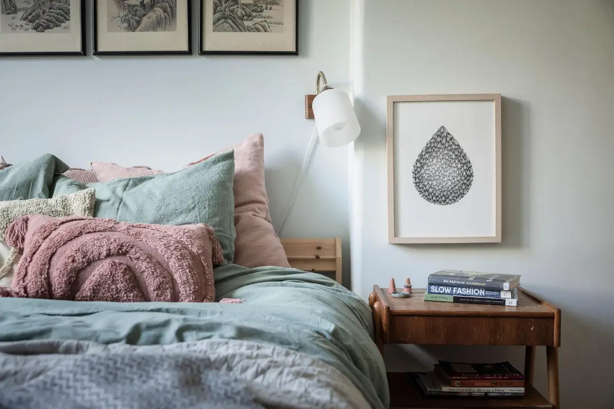 A Colorful 1920s Family Apartment in Sweden 23 light green bedroom bedside table