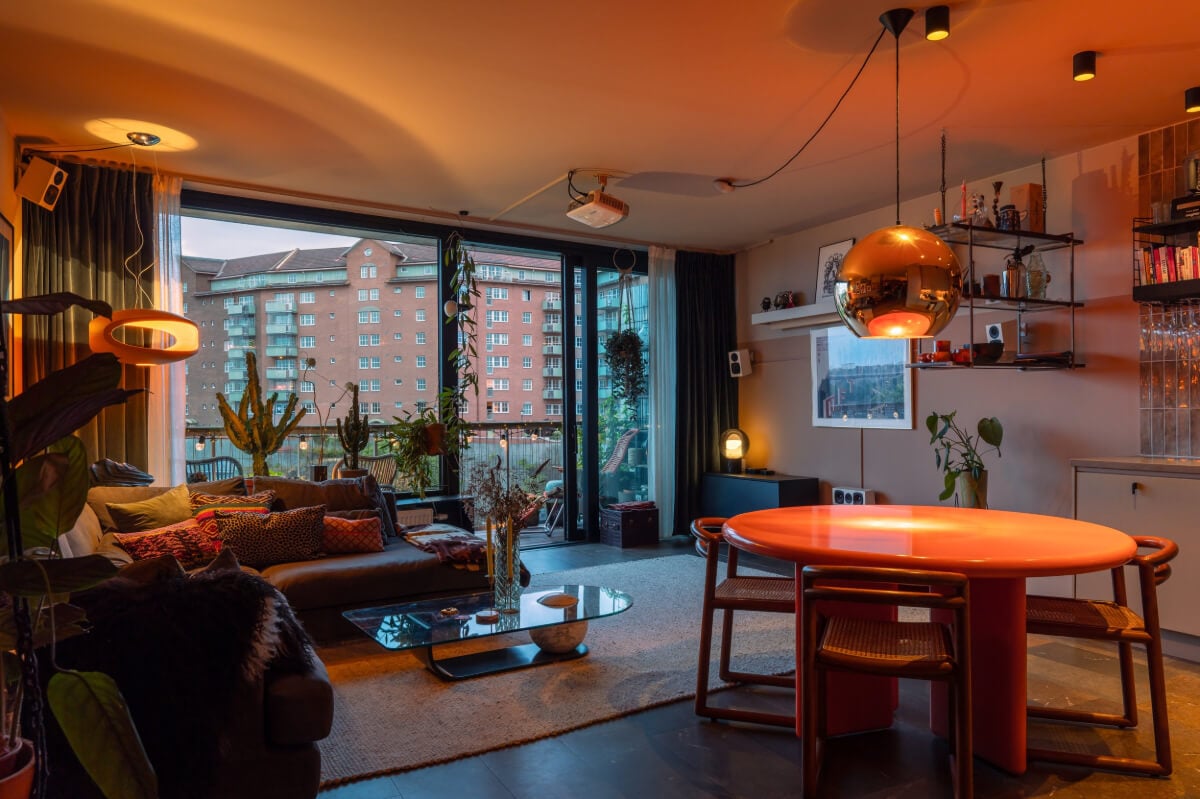 A Modern Swedish Apartment with Half-Painted Pink Walls 2 living room at night