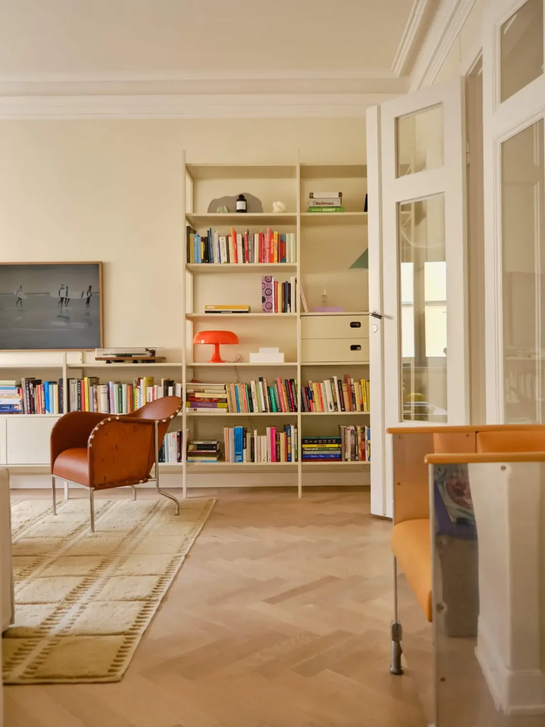 Pastel Hues in a Light-Filled 1880s Apartment in Stockholm 3 living room beige walls open cabinets nordroom