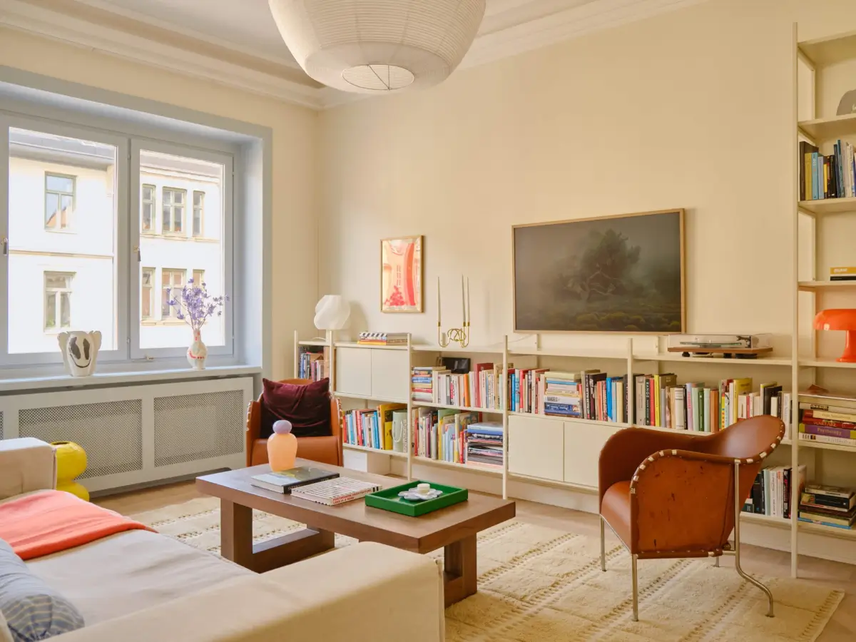 Pastel Hues in a Light-Filled 1880s Apartment in Stockholm 2 living room bookshelves